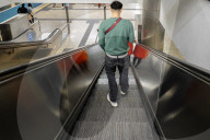 Passenger On Escalator In A Metro Train Station
