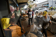 'Destruction everywhere': Taree cleanup begins as NSW floods reignite inter-agency tensions.