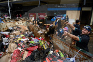 'Destruction everywhere': Taree cleanup begins as NSW floods reignite inter-agency tensions.