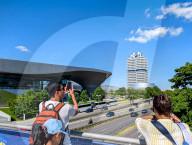 Tourists Photographing BMW Headquarters In Munich