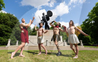 Australia's Head First Acrobats perform the feats of the ancient Greek Gods on the Archilles statue in Hyde Park, London, UK.