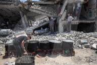 Palestinian Children Queue for Food Amid Ongoing Humanitarian Crisis in Gaza City