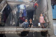 Palestinian Children Queue for Food Amid Ongoing Humanitarian Crisis in Gaza City
