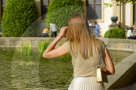 Woman By The Fountain