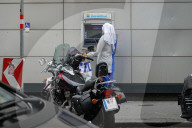 Woman With Baby Stroller At ATM