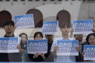 Activists Smash Ice To Protest Wage Freeze, Discrimination