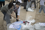 Activists Smash Ice To Protest Wage Freeze, Discrimination