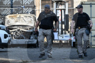 Multiple Vehicles Were Set On Fire In An Arson Attack In A Parking Lot With NYPD Vehicles On Myrtle Avenue And DeKalb Avenue
