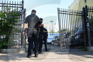 Multiple Vehicles Were Set On Fire In An Arson Attack In A Parking Lot With NYPD Vehicles On Myrtle Avenue And DeKalb Avenue