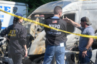 Multiple Vehicles Were Set On Fire In An Arson Attack In A Parking Lot With NYPD Vehicles On Myrtle Avenue And DeKalb Avenue