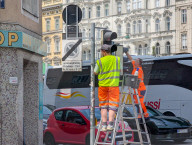 Municipal Workers Cleaning Traffic Lights In Vienna