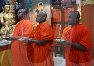 Buddhist Monks  And Devotees Offering Prayers In The Memory Of Victims Of Air India Plane Crash 