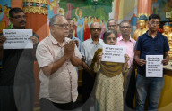 Buddhist Monks  And Devotees Offering Prayers In The Memory Of Victims Of Air India Plane Crash 