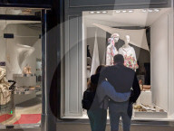 Couple Window Shopping At Luxury Boutique