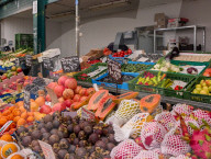 Fruit And Vegetable Stalls At Outdoor Grocery Market