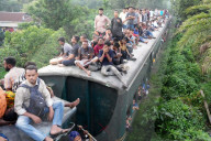 People Return To Dhaka On Overcrowded Trains In Bangladesh