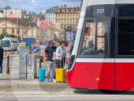 Tourists With Rolling Suitcases In Central Vienna