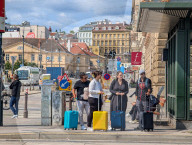 Tourists With Rolling Suitcases In Central Vienna