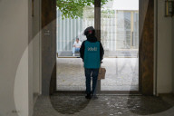Wolt Food Courier Waiting At Entrance