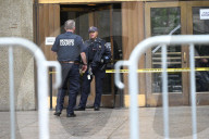Numerous Officers Stand Guard And Maintain A Security Cordon After Multiple New York State Court Officers Were Slashed By A Suspect At 100 Centre Street
