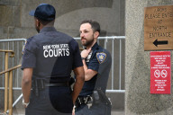 Numerous Officers Stand Guard And Maintain A Security Cordon After Multiple New York State Court Officers Were Slashed By A Suspect At 100 Centre Street