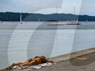 Sunbathing Woman At Lake
