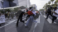 Peaceful Anti-Ice Protesters Face Off Against Law Enforcement Following "No Kings" Protest