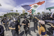 Peaceful Anti-Ice Protesters Face Off Against Law Enforcement Following "No Kings" Protest