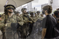 Peaceful Anti-Ice Protesters Face Off Against Law Enforcement Following "No Kings" Protest