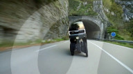 Tilting electric car steered with handlbars
