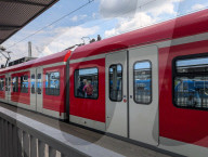 S-Bahn At Munich Pasing Station With Reflected Passengers