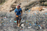 Discarded clothes from UK brands dumped in protected Ghana wetlands