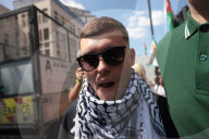 Member of Irish band Kneecap in court for waving Hezbollah flag at concert