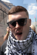 Member of Irish band Kneecap in court for waving Hezbollah flag at concert