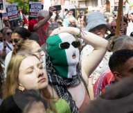 Kneecap’s Liam Óg Ó hAnnaidh freed on bail as hundreds of supporters gather at Westminster Magistrates Court, London, UK.