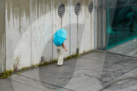Woman With Umbrella On A Rainy Day