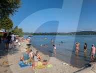 People Cool Off During Warm Weather At Lake