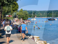 People Cool Off During Warm Weather At Lake