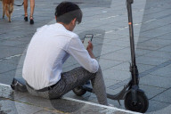 Young Man With E-Scooter