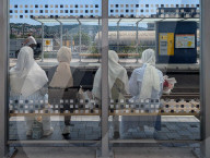 Women Waiting At City Train Station