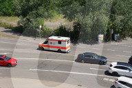German Red Cross Ambulance In City Traffic In Stuttgart