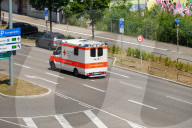 German Red Cross Ambulance In City Traffic In Stuttgart