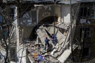 Rescuers Evacuate The Body Of A Victim During Search And Rescue Operations At The Site Of A Russian Missile Strike On Kyiv