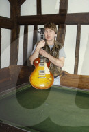 Photo of Mick Ralphs at home in 1984,