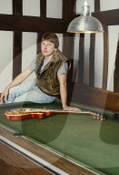 Photo of Mick Ralphs at home in 1984,