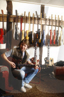Photo of Mick Ralphs at home in 1984,