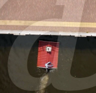 Roofline-shaped boat highights rising sea levels