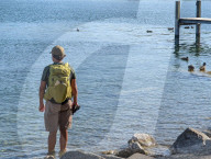 Hiker Standing In Lake