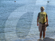 Hiker Standing In Lake