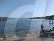 Hiker Standing In Lake